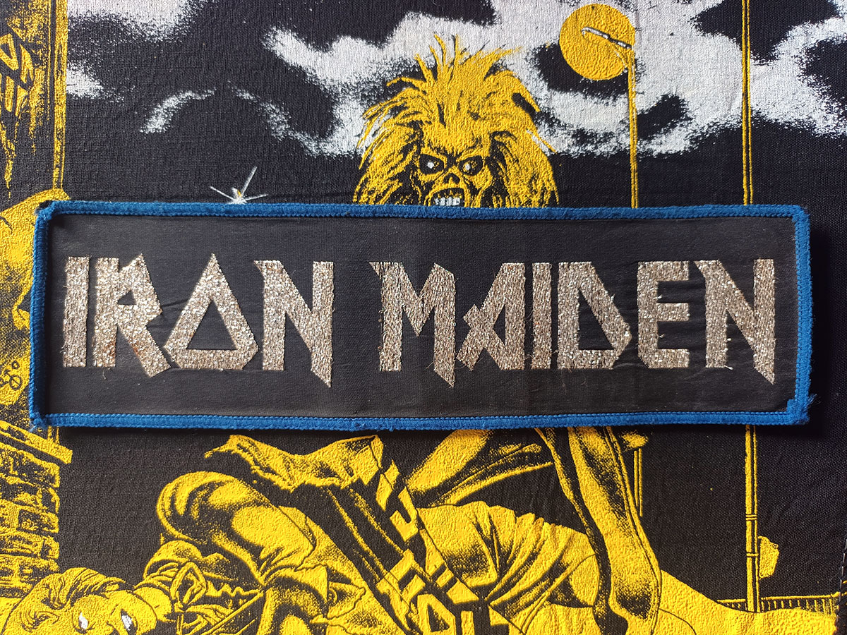 Iron Maiden "Silver Logo" Blue Border Woven Strip Patch